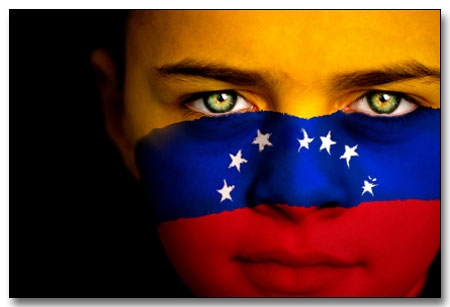 Portrait of a boy with the flag of Venezuela (Seven star version) painted on his face